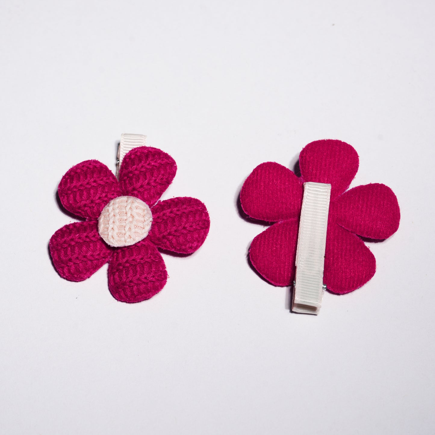 Red Crochet Floral hair Pins with white center and metal clip back shown on white background