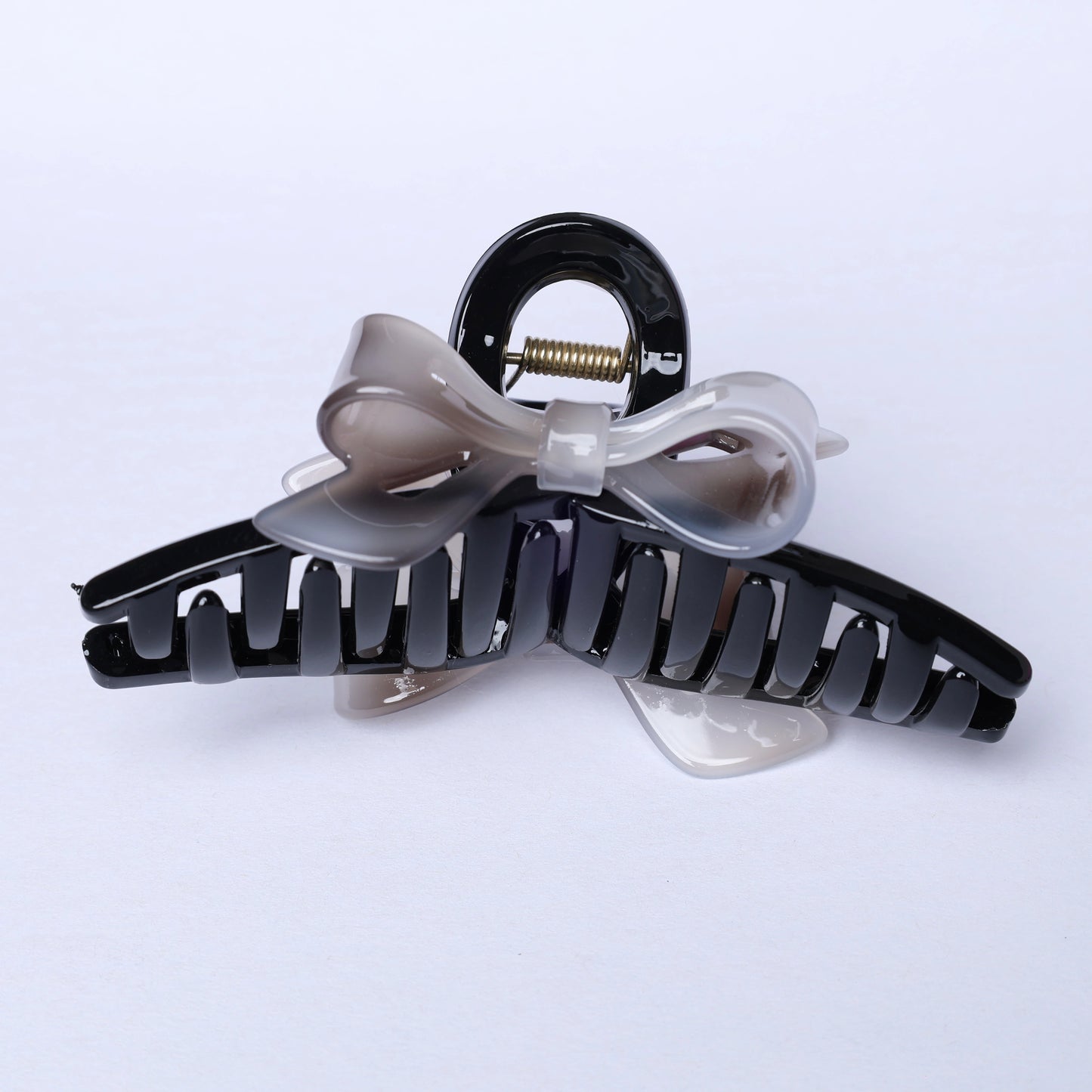 Black and translucent gray bow hair clutches with spring mechanism for secure hold