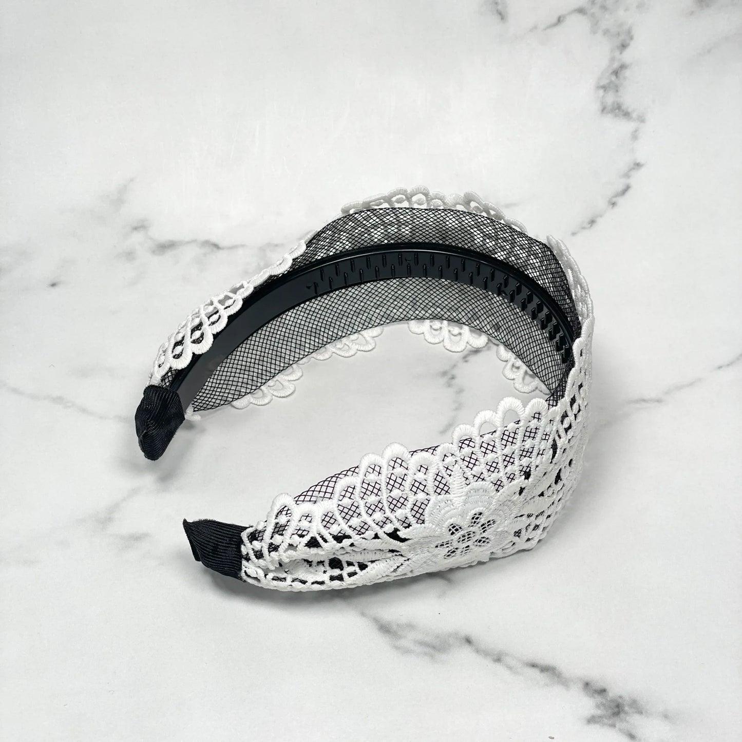 White broad lace hairbands with floral pattern and black inner grip for secure fit