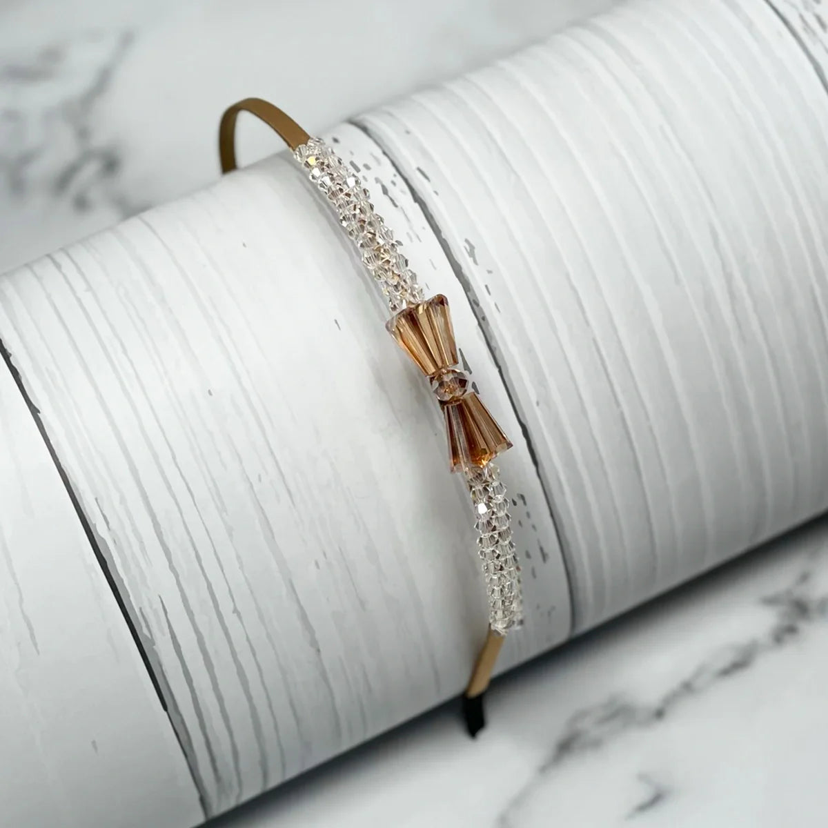 Elegant crystal bow hairbands with sparkling crystals and a delicate bow design on a thin band