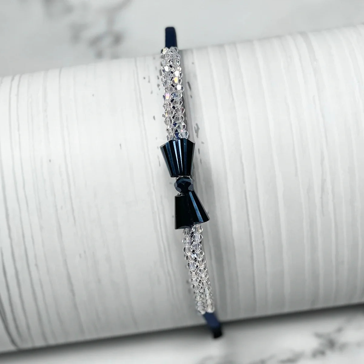 Elegant crystal bow hairbands featuring sparkling crystals and black bow detail for stylish wear
