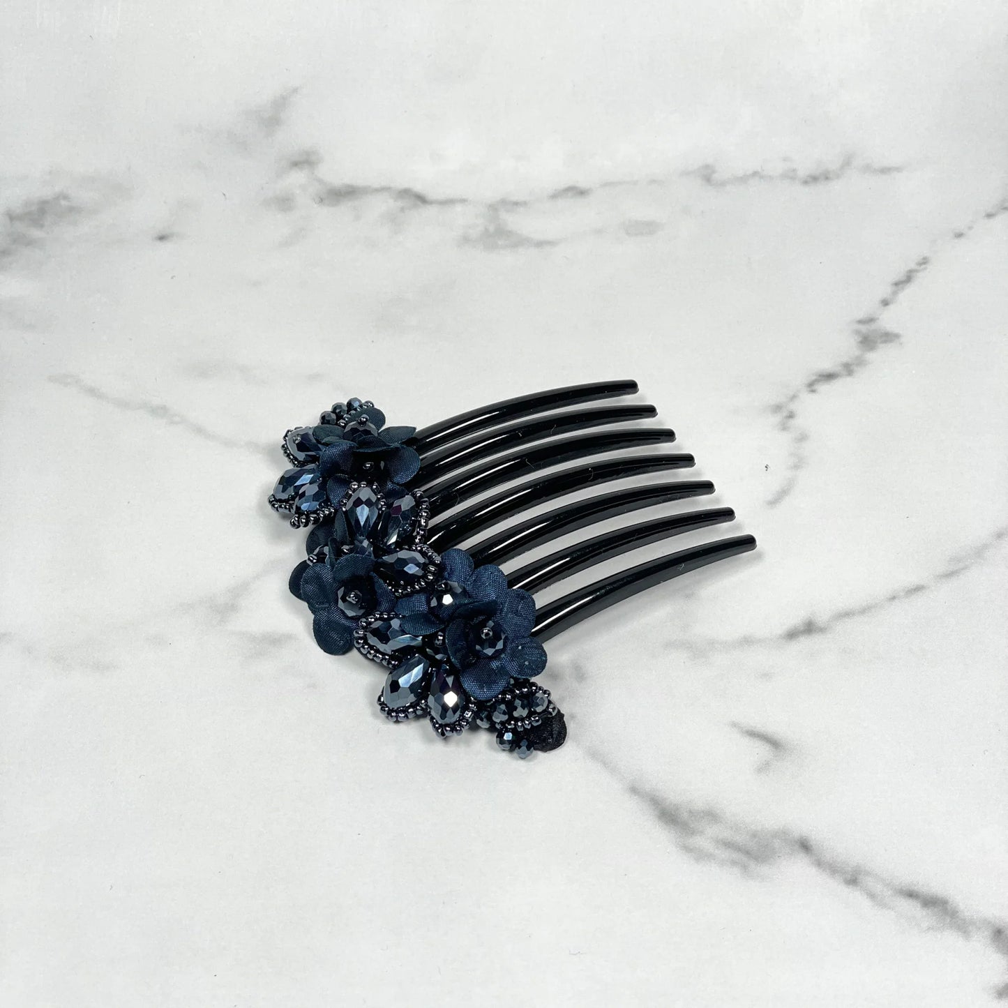 Black hair comb with dark blue crystal studded comb clips decorated with floral designs