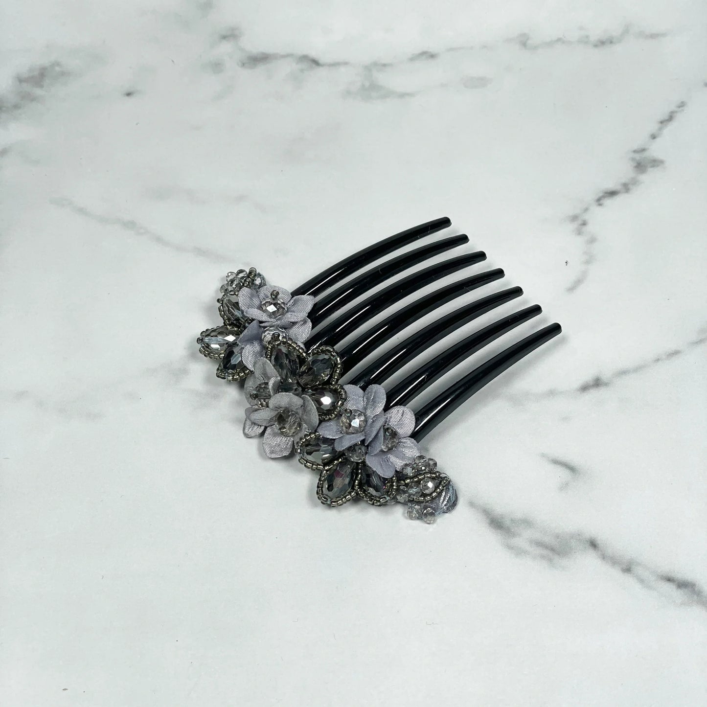 Black hair comb with delicate grey flowers and crystal studded comb clips embedded in decorative design
