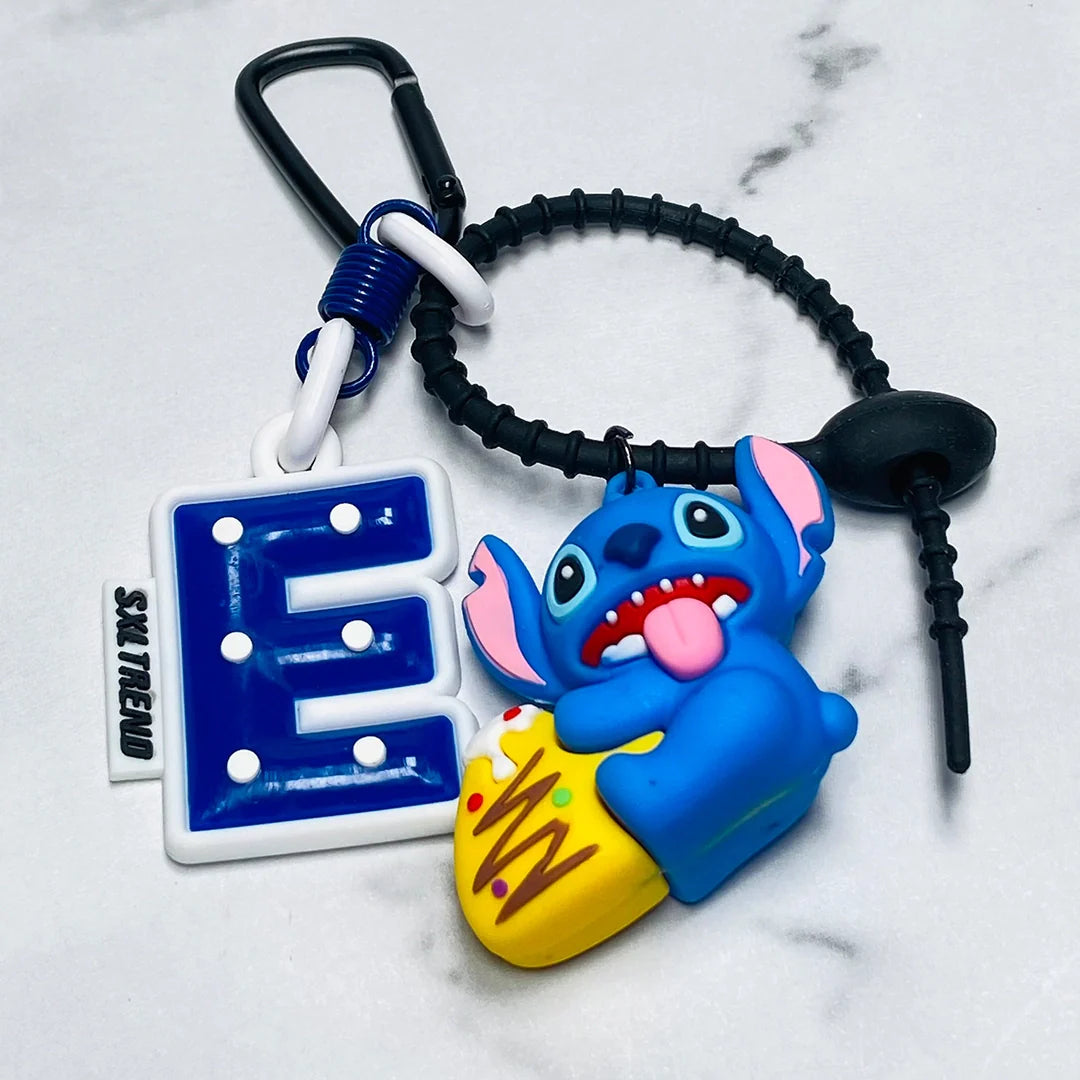 Blue Stitch character Disney bag tag attached to a black strap with a blue letter E charm