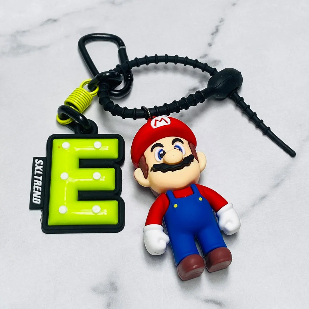 Disney bag tag featuring a green letter E and a Mario character keychain with a black clip