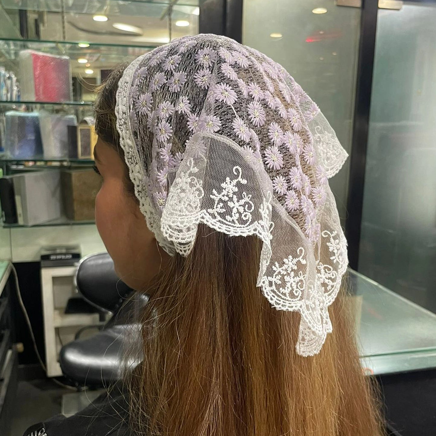 Bella Luxe Embroidered Shimmery Lacy Bandana worn over long brown hair in a salon