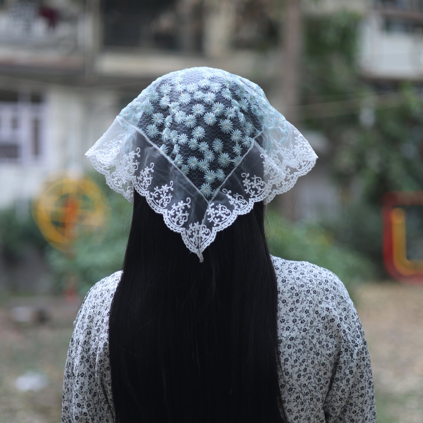 Bella Luxe Embroidered Shimmery Lacy Bandana worn on long black hair with floral pattern
