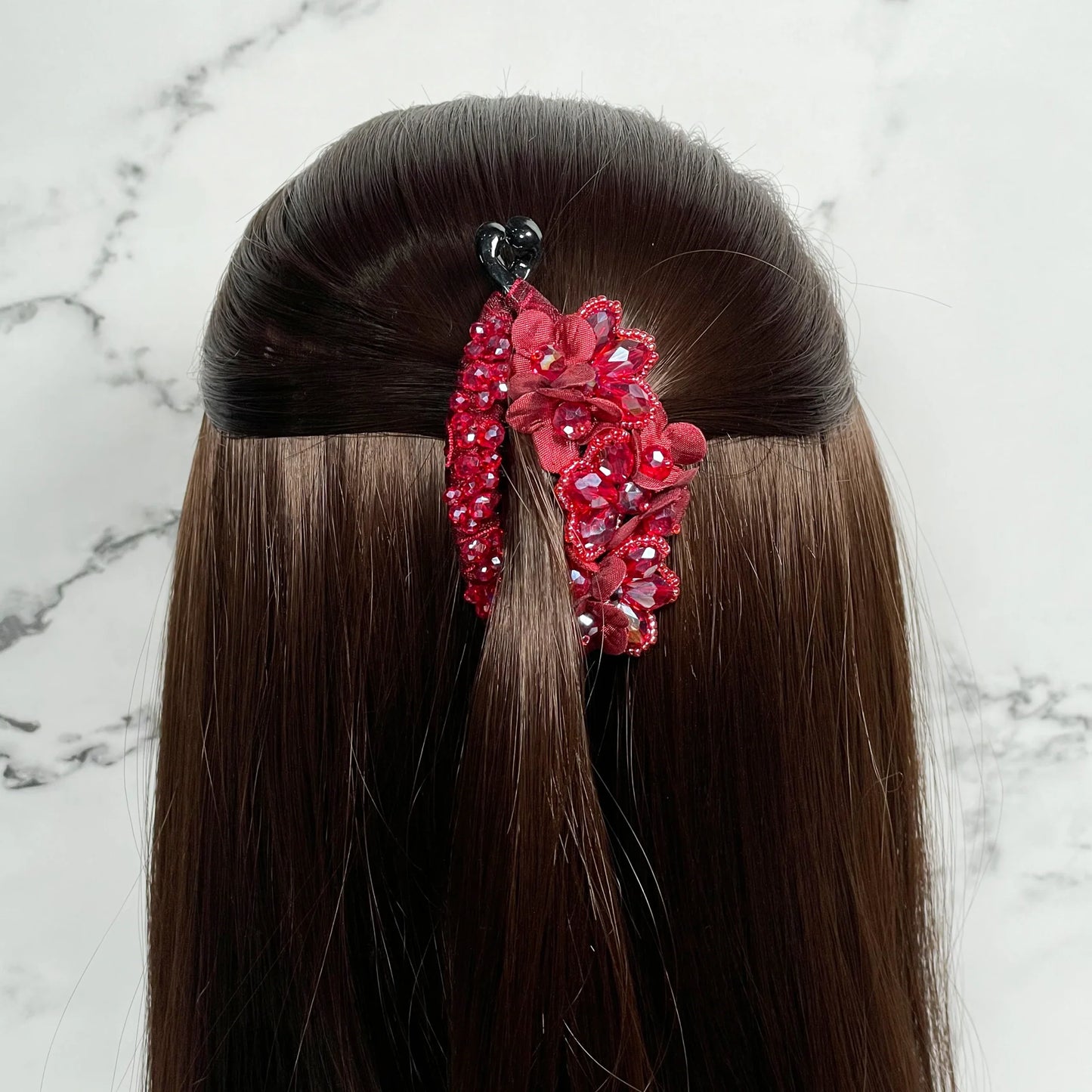 Red Floral and Crystal Studded Banana Clips securing half-up hairstyle on long brown hair