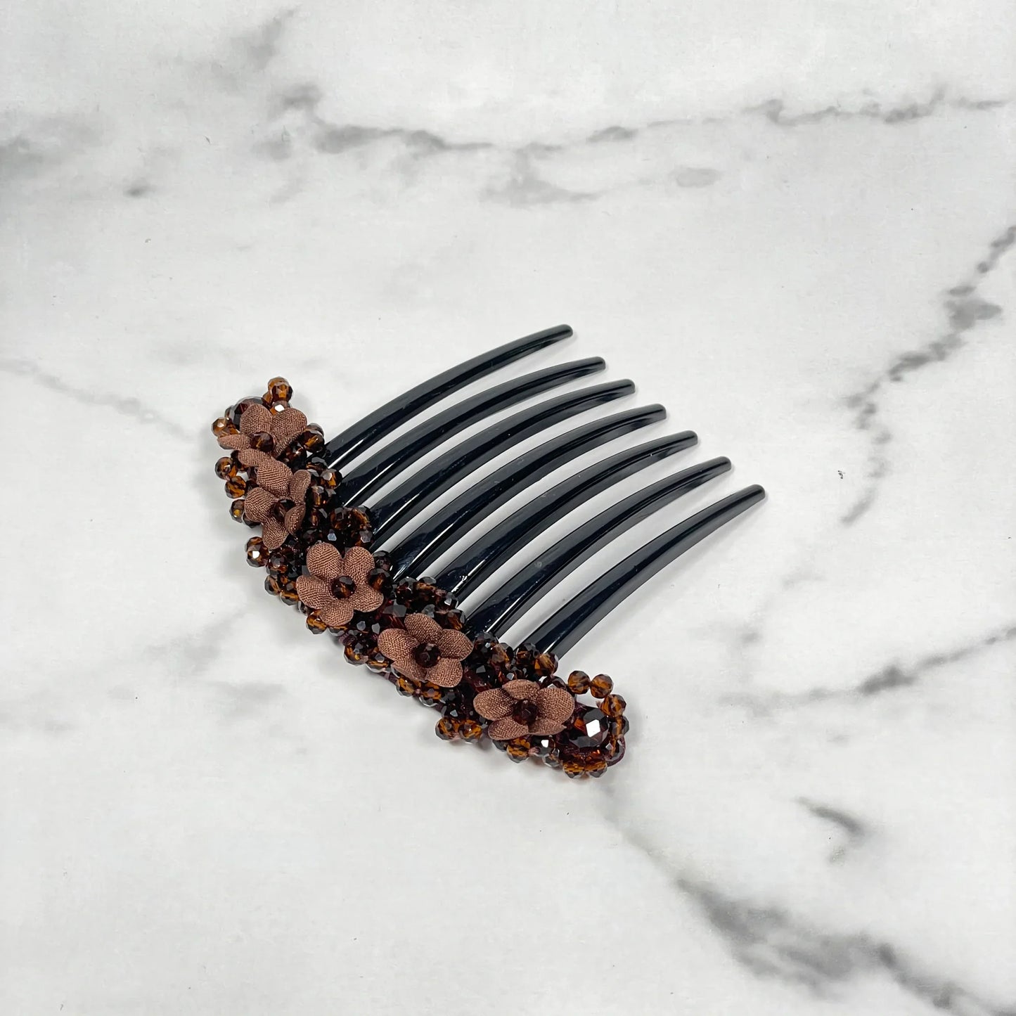 Brown floral beaded hair comb clips with flower embellishments on black comb base