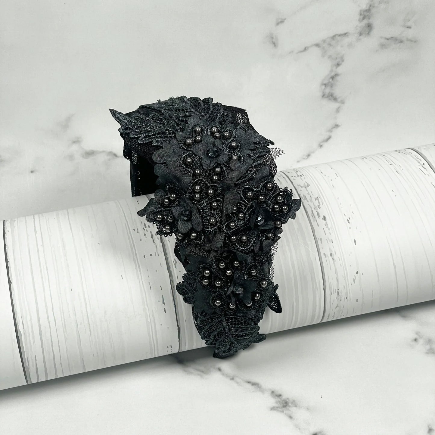 Black floral lacy hairbands with cutwork featuring intricate bead detailing on white background