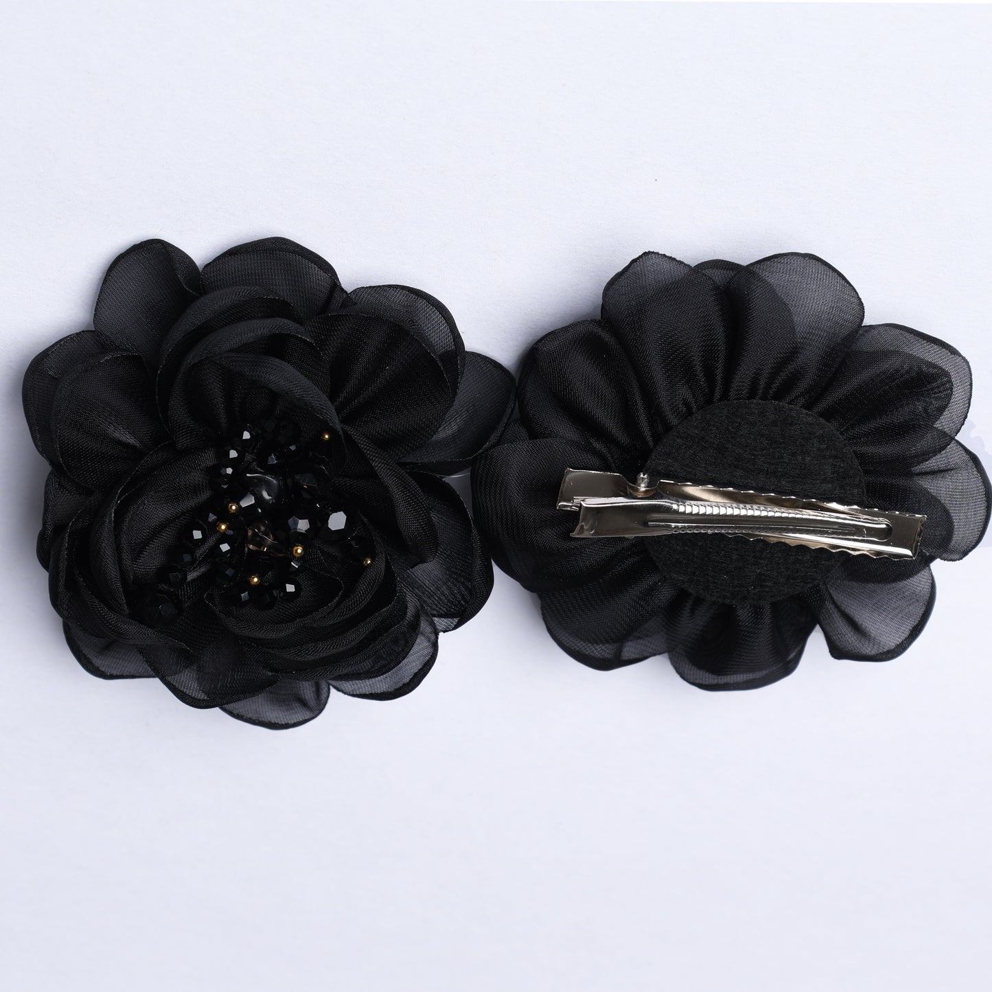 Black floral organza hair pins with layered petals and beaded center detail