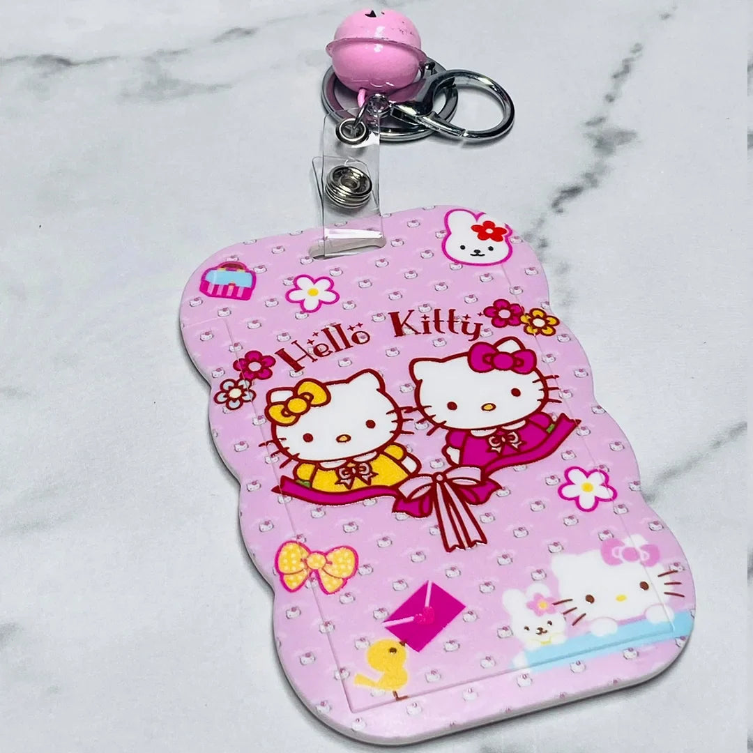 Pink Hello Kitty key chains with name tags featuring two cute cats and colorful decorative elements