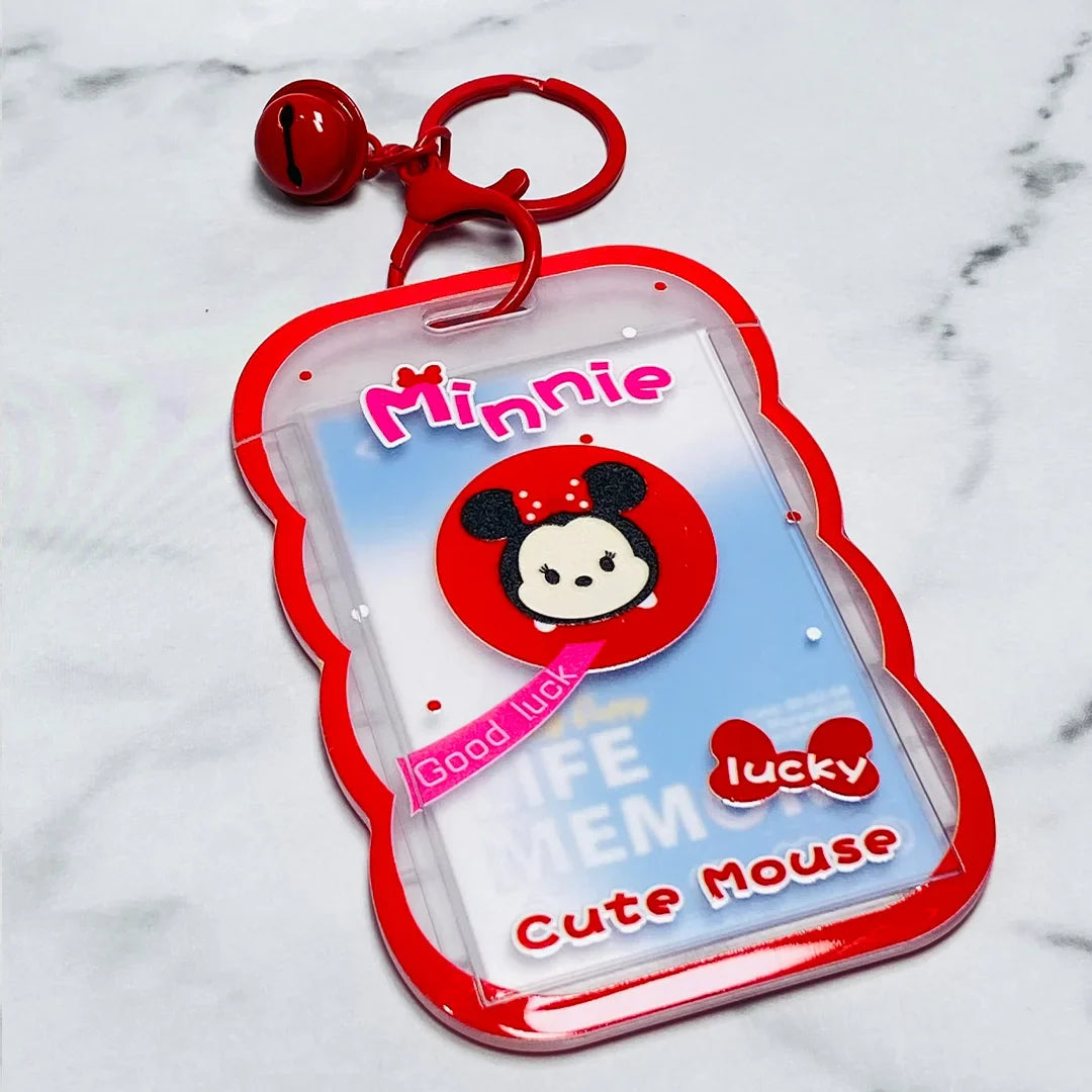 Minnie Mouse key chains with name tags in red and clear plastic featuring a bell and clip