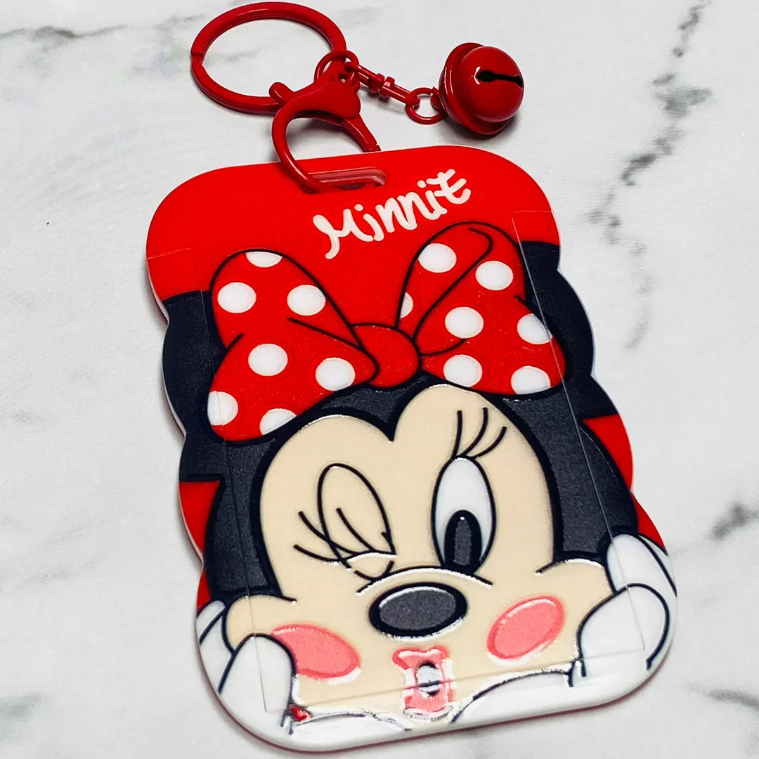 Red Minnie Mouse key chains with name tags featuring polka dot bow and bell accessory