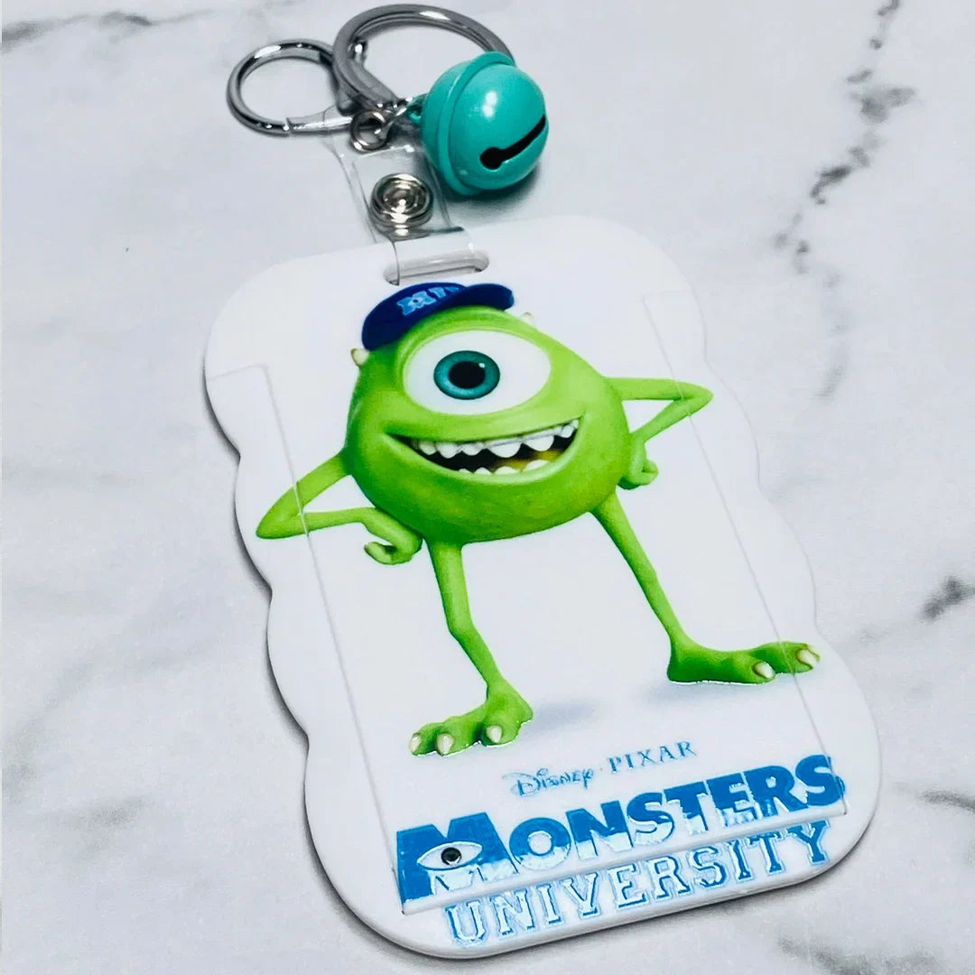 Monsters University key chains with name tags featuring Mike Wazowski character and attached teal bell