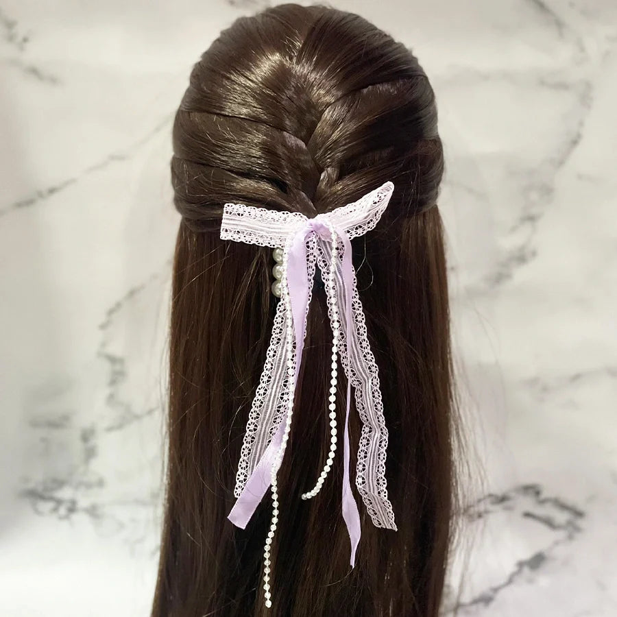 Lace satin pearl hair ties with delicate lace and pearls tied in a bow on dark brown hair