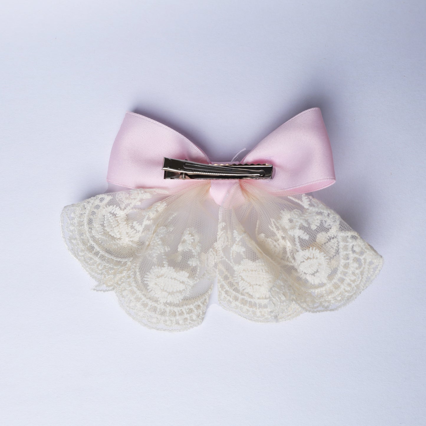 Lacy bow frill alligator clip with pink satin bow and delicate white lace frill accessory