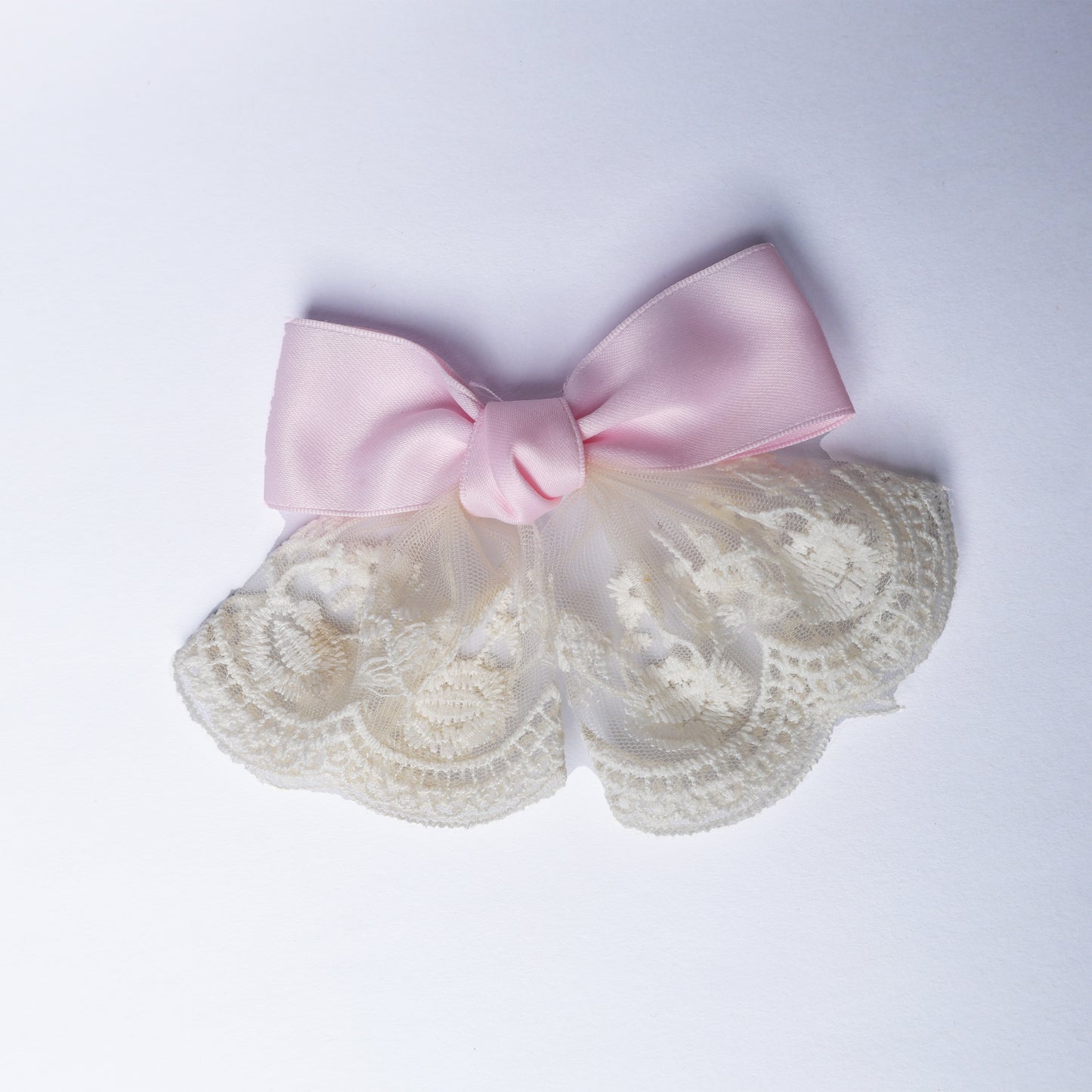 Pink lacy bow frill alligator clip with delicate cream lace detailing for hair decoration