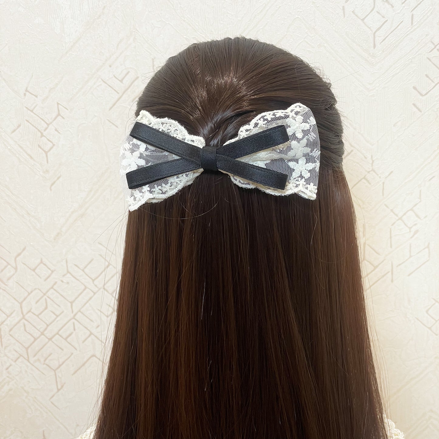 Lacy Bows with Ribbon hair accessory in black and white lace styled on long brown hair