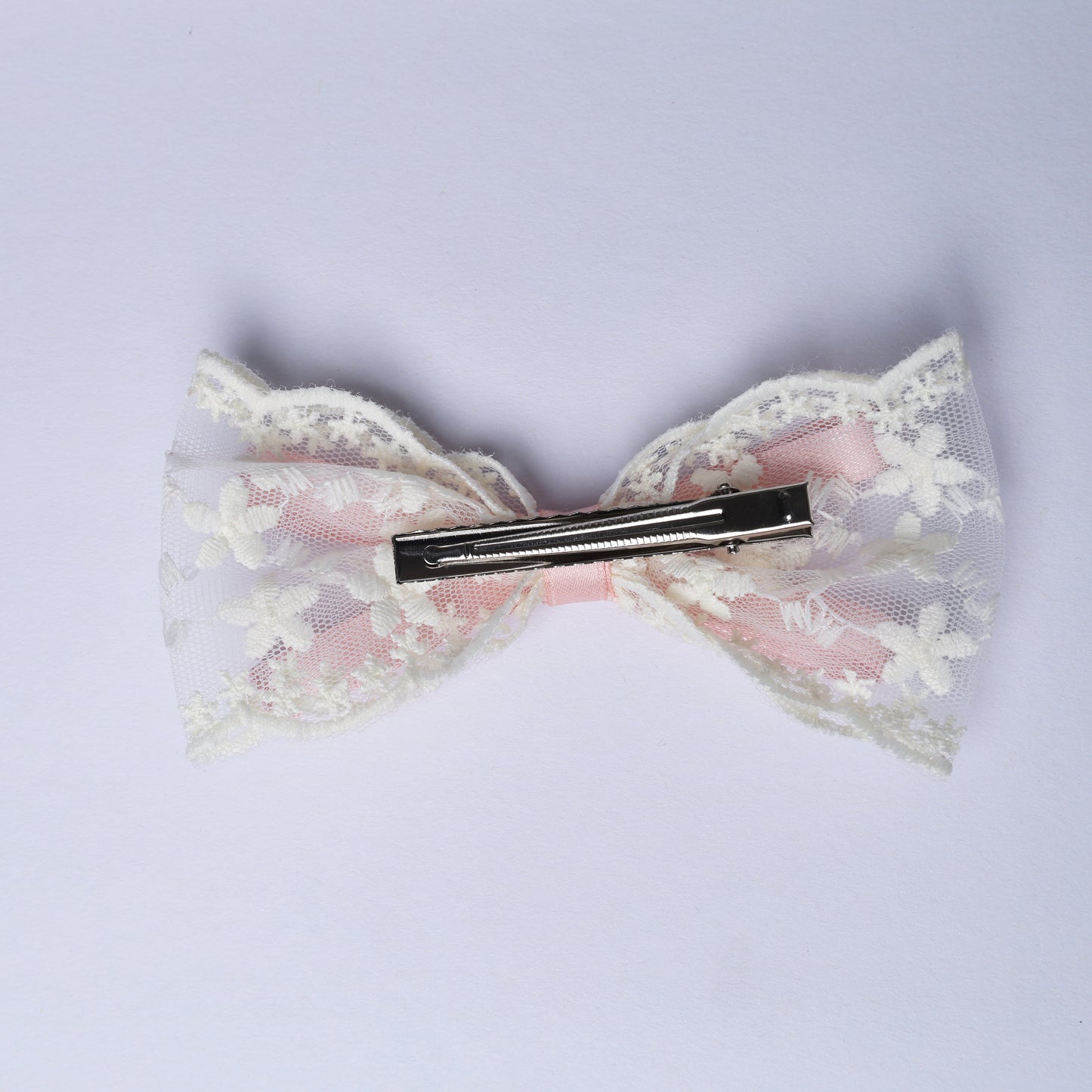 Lacy Bows with Ribbon hair clip featuring white floral lace over pink fabric for stylish accessorizing
