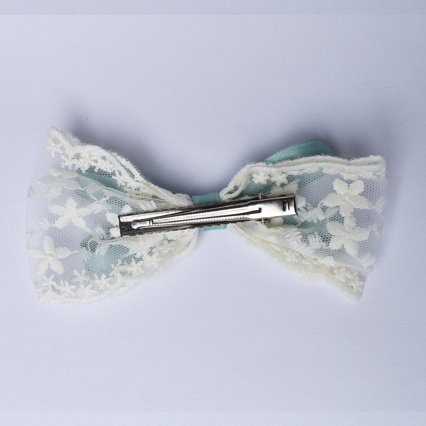 Lacy Bows with Ribbon hair accessory featuring white floral lace and a metal clip on the back
