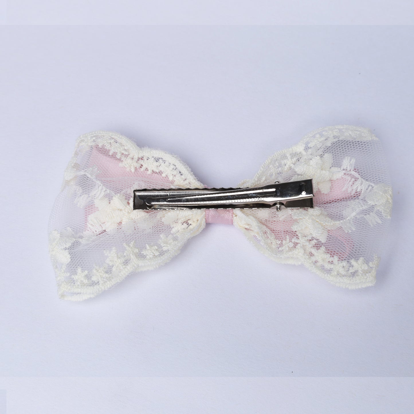 Lacy Bows with Ribbon hair clip featuring delicate white lace and pink fabric detail