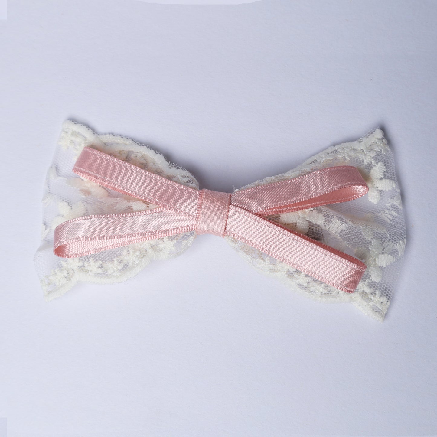 Pink Lacy Bows with Ribbon featuring delicate white lace detailing on a soft background