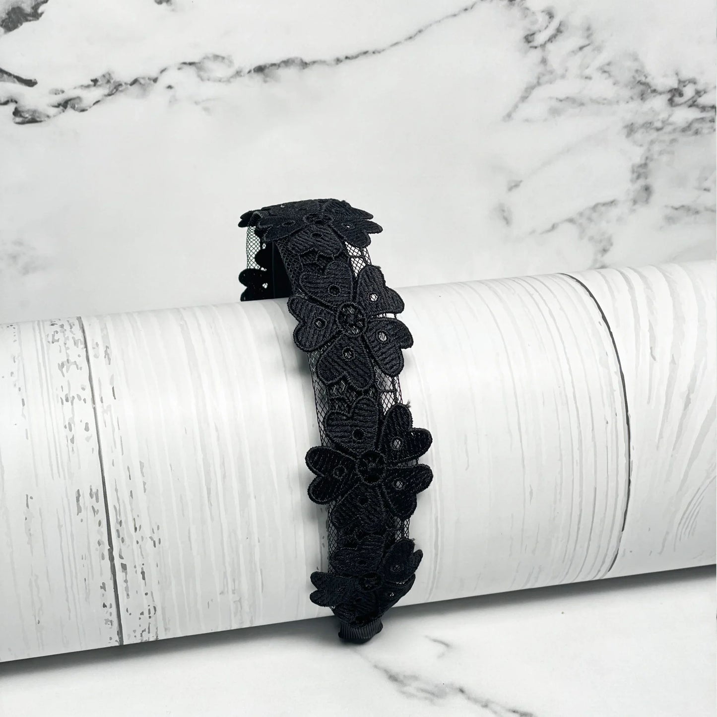 Black Medium Broad Lacy Floral Hairbands with intricate floral lace design on white background