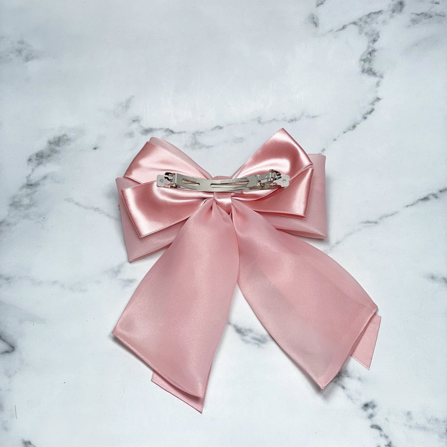 Pink Organza and Satin Bow Clips with metal clip on marble background for hair accessories