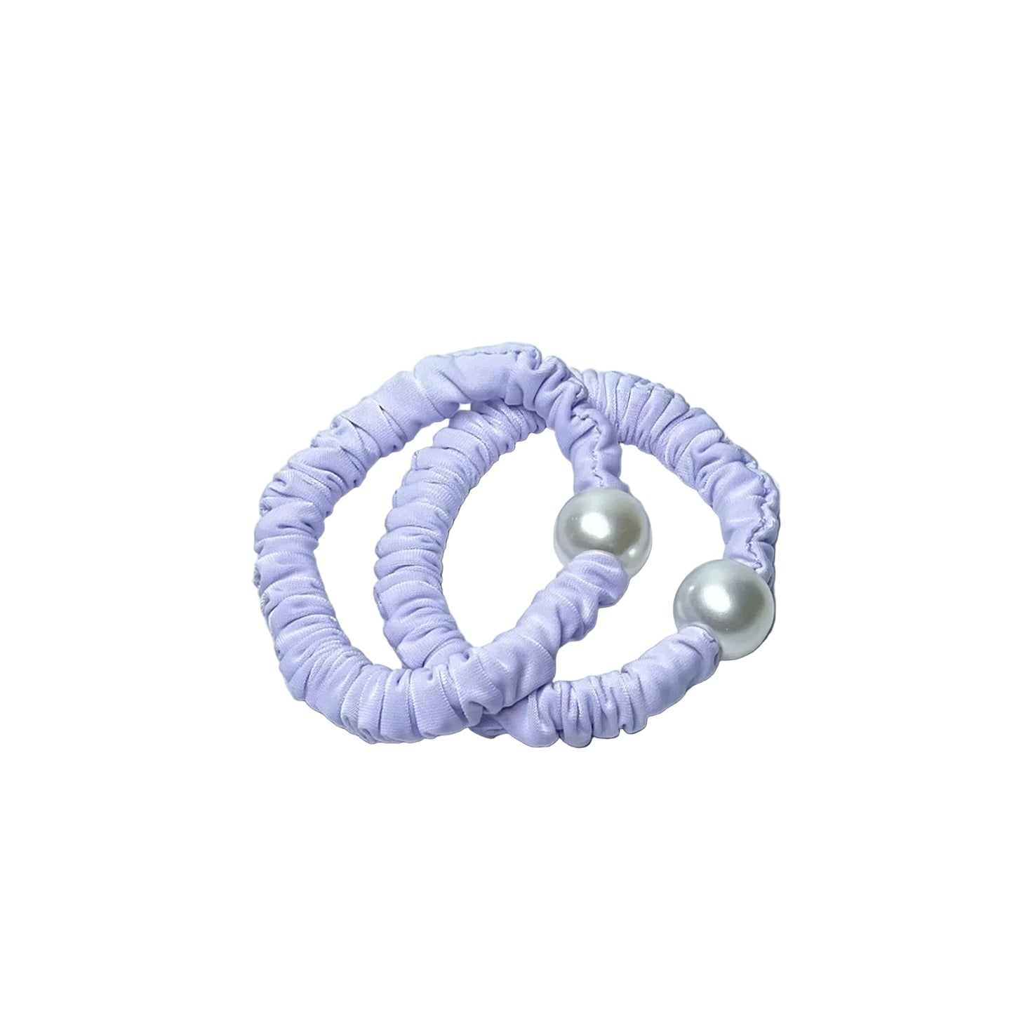 Pastel hair ties with pearl detail in soft lavender color on marble background