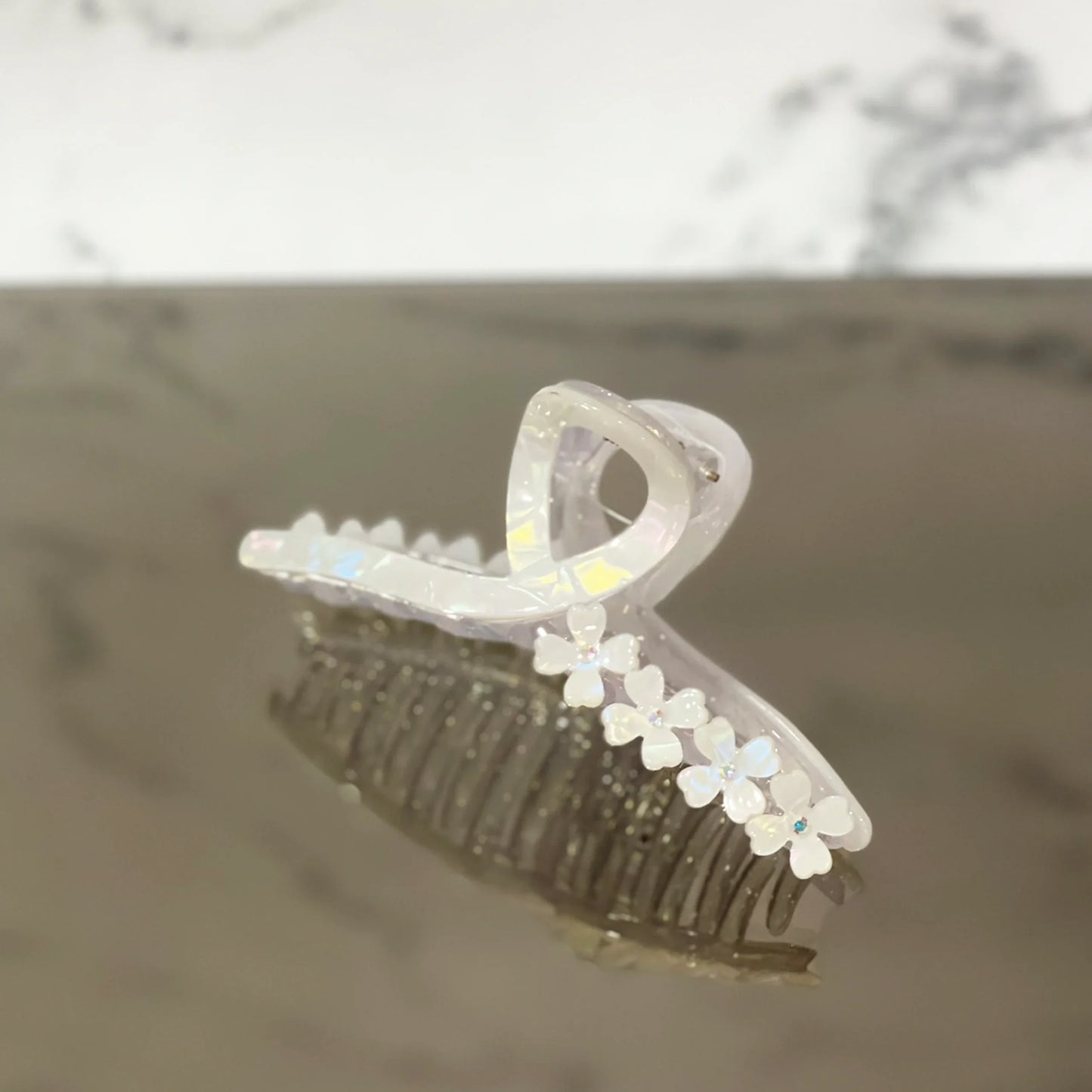 Clear pearl floral hair clutches with small white flower accents for elegant hair styling