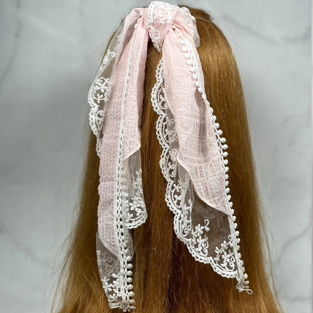 Bella Luxe pink lacy georgette hair scarf with delicate white lace tied on long brown hair
