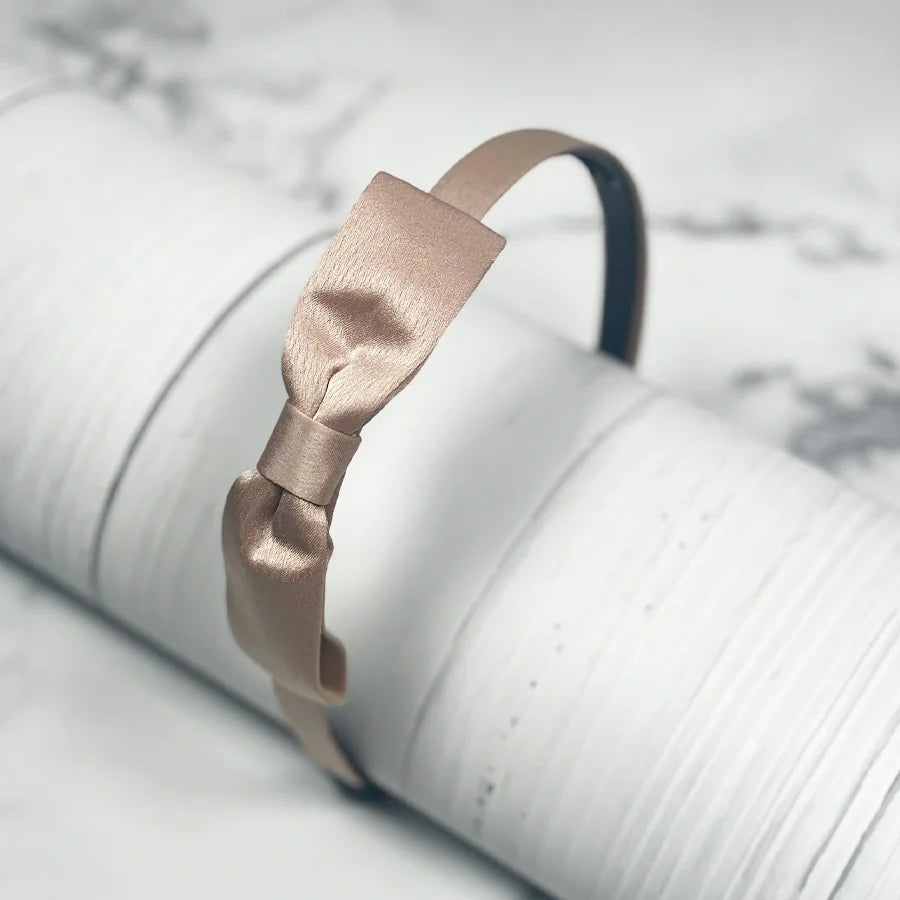 Beige satin bow hairbands with a smooth satin finish for stylish hair accessories