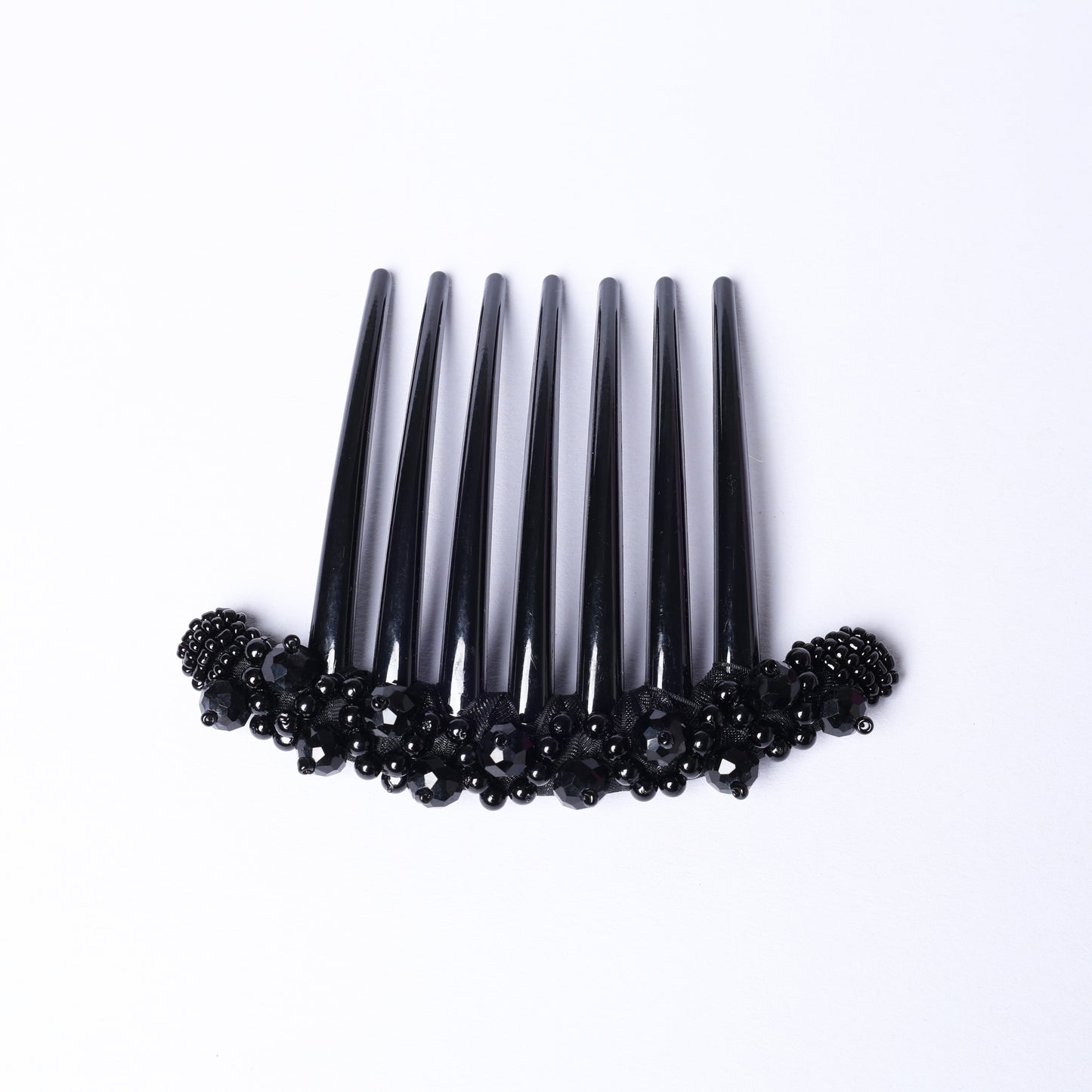 Black studded comb clips with decorative black beads for stylish hair accessory