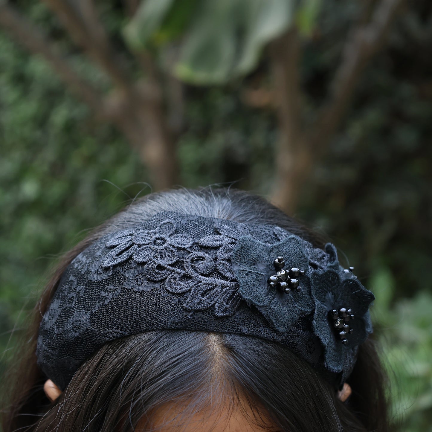 Black lace three flower broad hairbands with bead details worn on dark hair