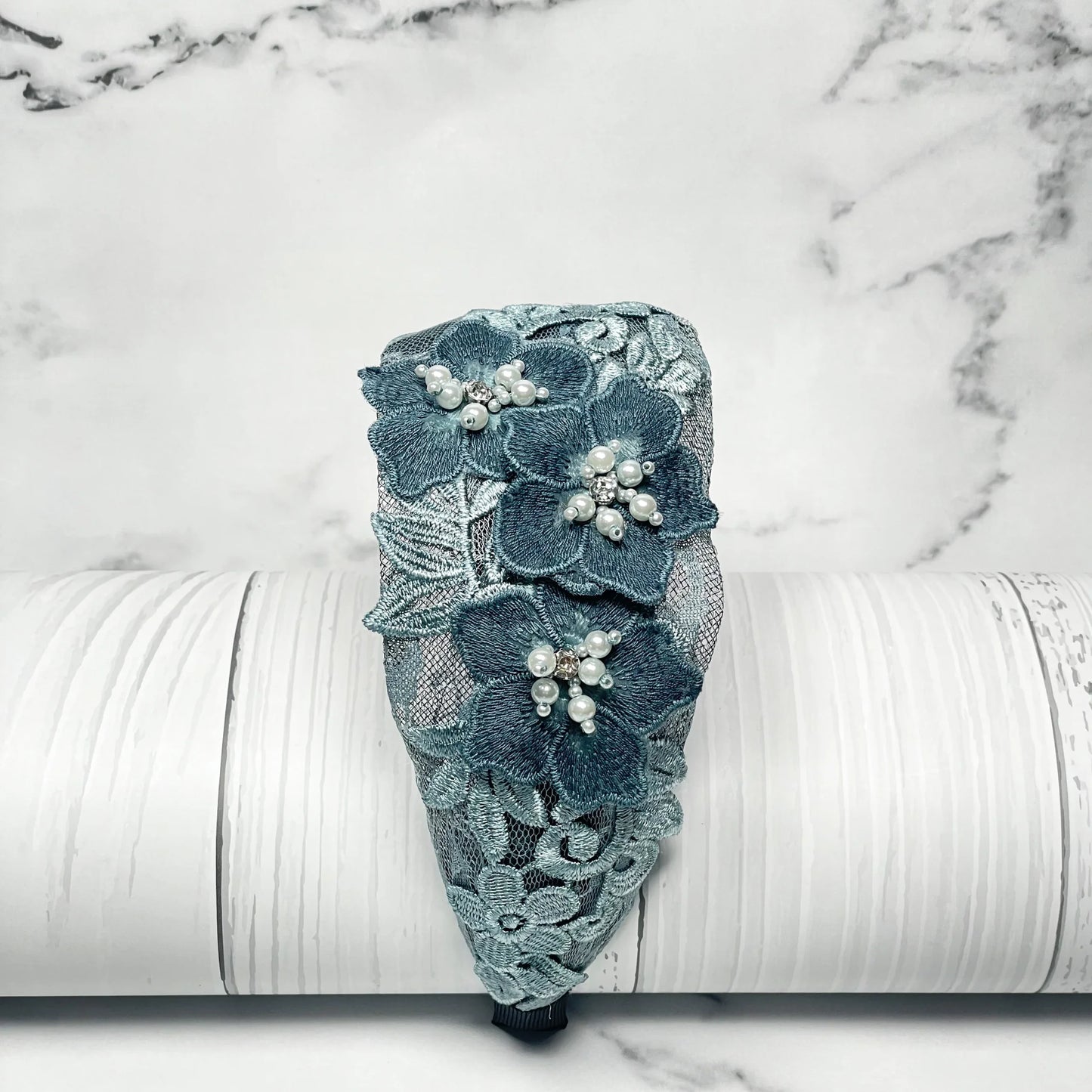 Three flower broad hairbands in blue lace with pearl embellishments and floral design