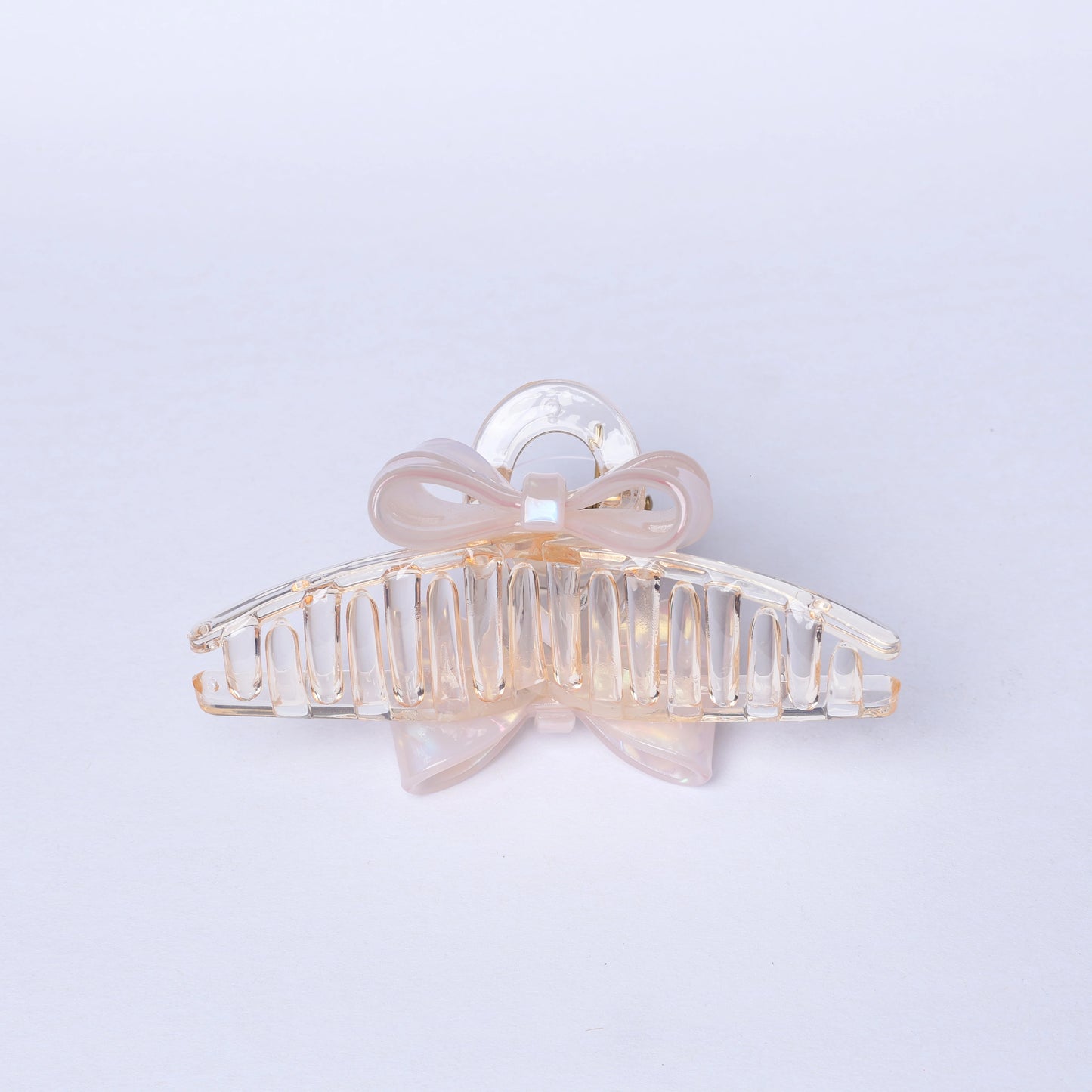 Transparent bow hair clutches with a delicate light pink bow detail for stylish hair styling