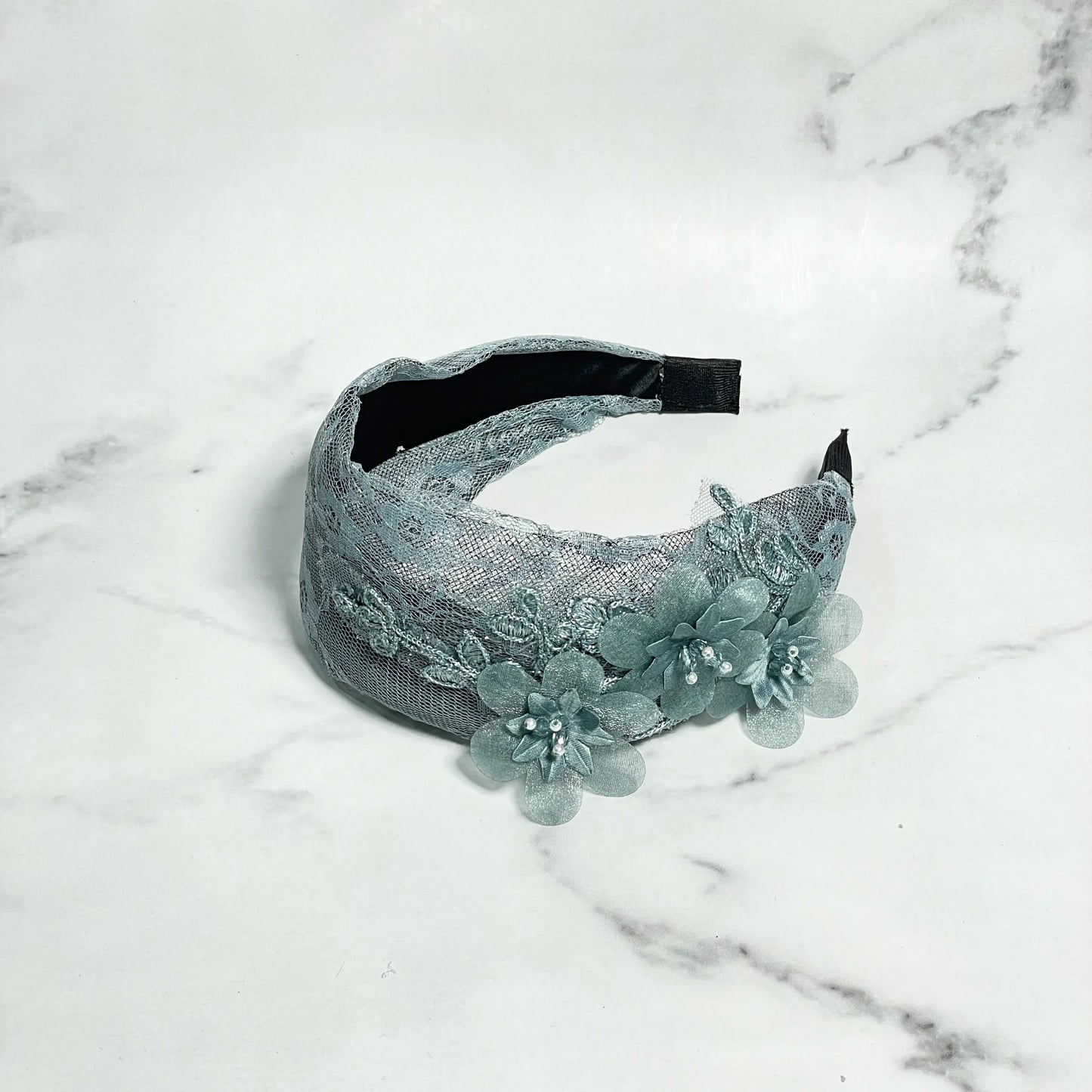 Broad shimmery lacy hairbands in light blue with floral appliques and pearl accents