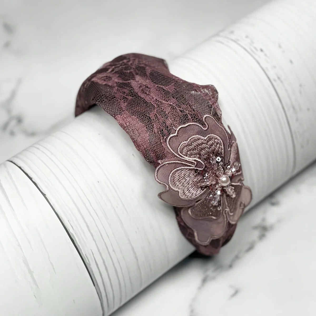 Lacy embellished hairbands for women in mauve with floral applique and bead details