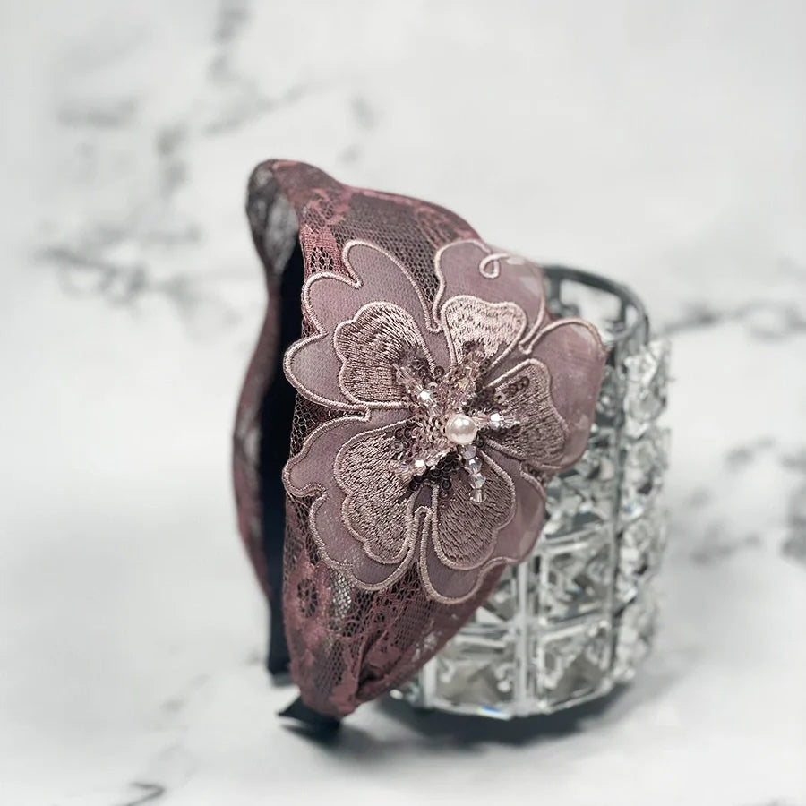 Lacy embellished hairbands for women with large floral lace design and bead accents in soft mauve color