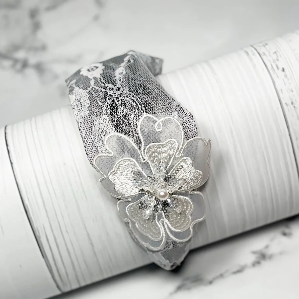 Gray lacy embellished hairbands for women with floral design and pearl detail accessory