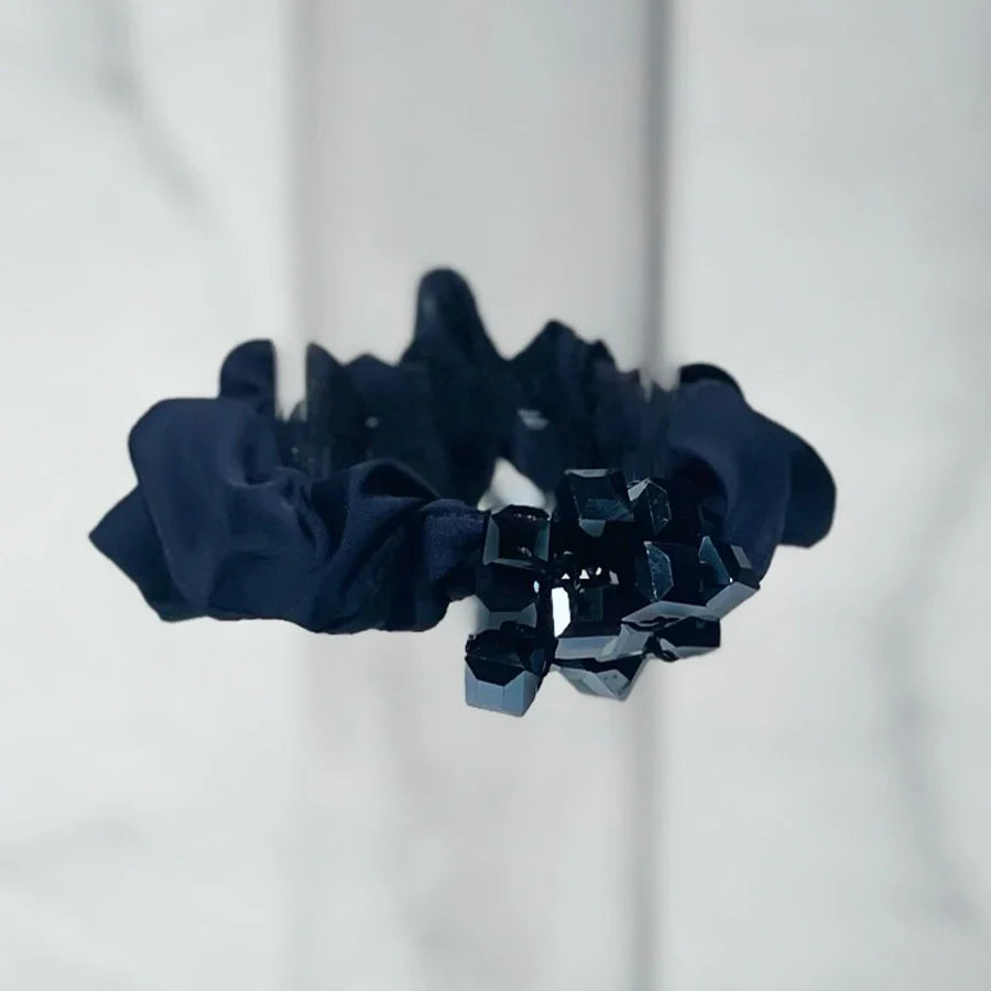 Black crystal studded hair ties with faceted dark crystals on scrunchie fabric