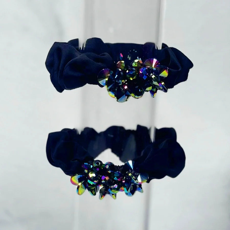 Black crystal studded hair ties with colorful gemstone embellishments for elegant hairstyles