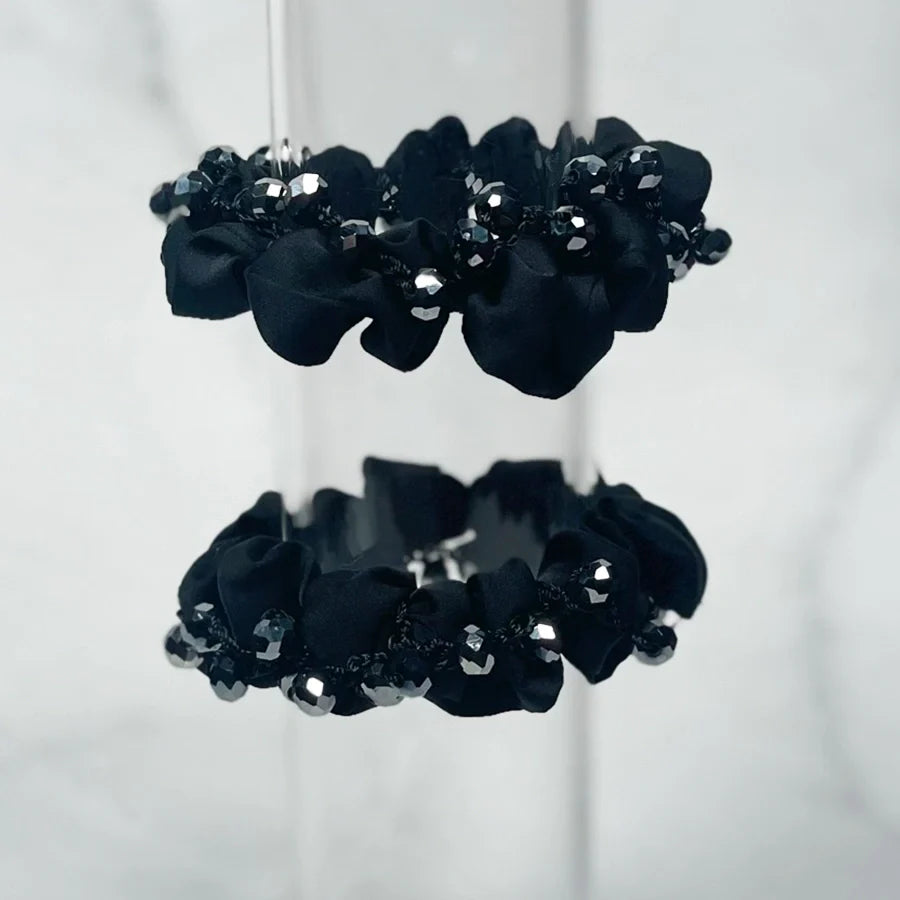 Blue crystal studded hair ties with sparkling decorative beads perfect for stylish hair accessorie