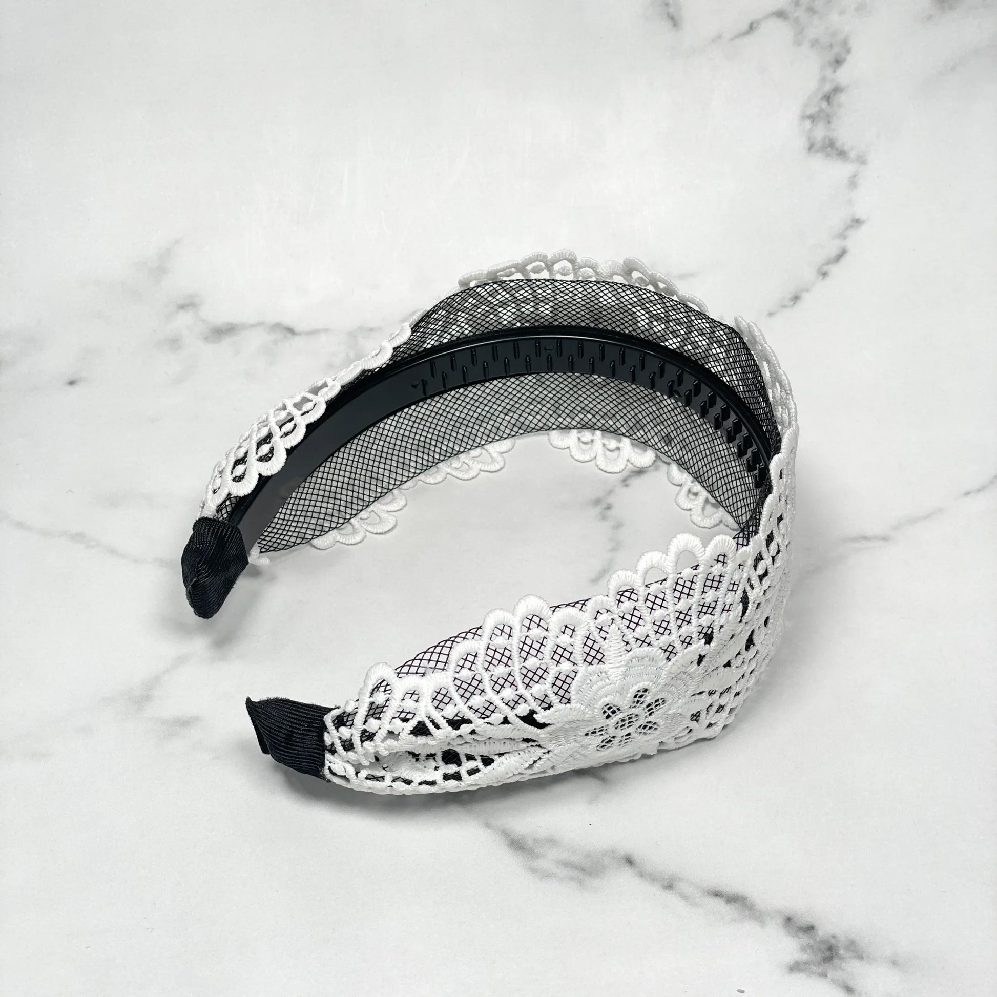 White broad lace hairbands with floral pattern and black inner grip for secure fit