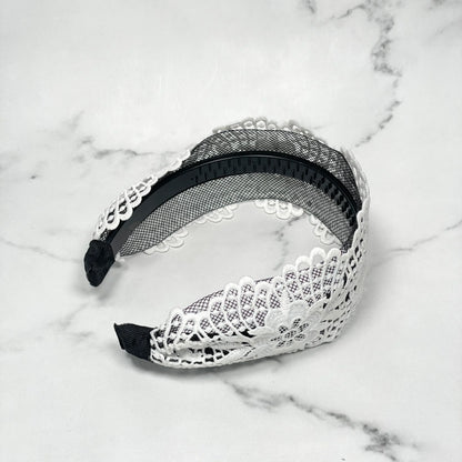 White broad lace hairbands with floral pattern and black inner grip for secure fit