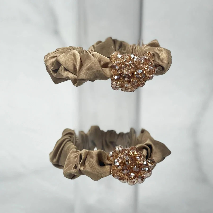 Beige crystal studded hair ties with sparkling gem cluster decoration on soft fabric bands