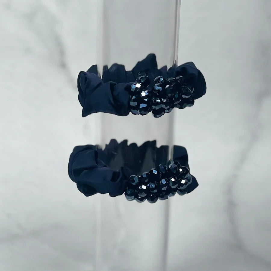 Black crystal studded hair ties with shiny embellishments for stylish hair accessories