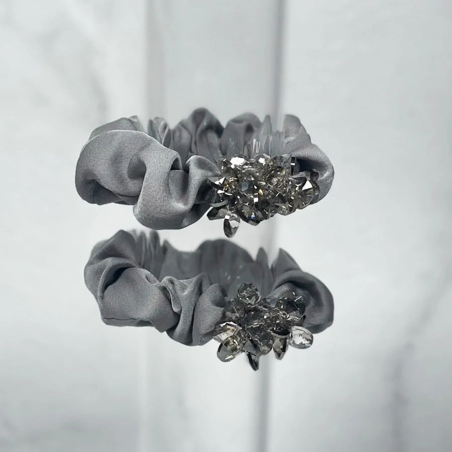 Gray fabric crystal studded hair ties with decorative clear crystal clusters for stylish hair accessories