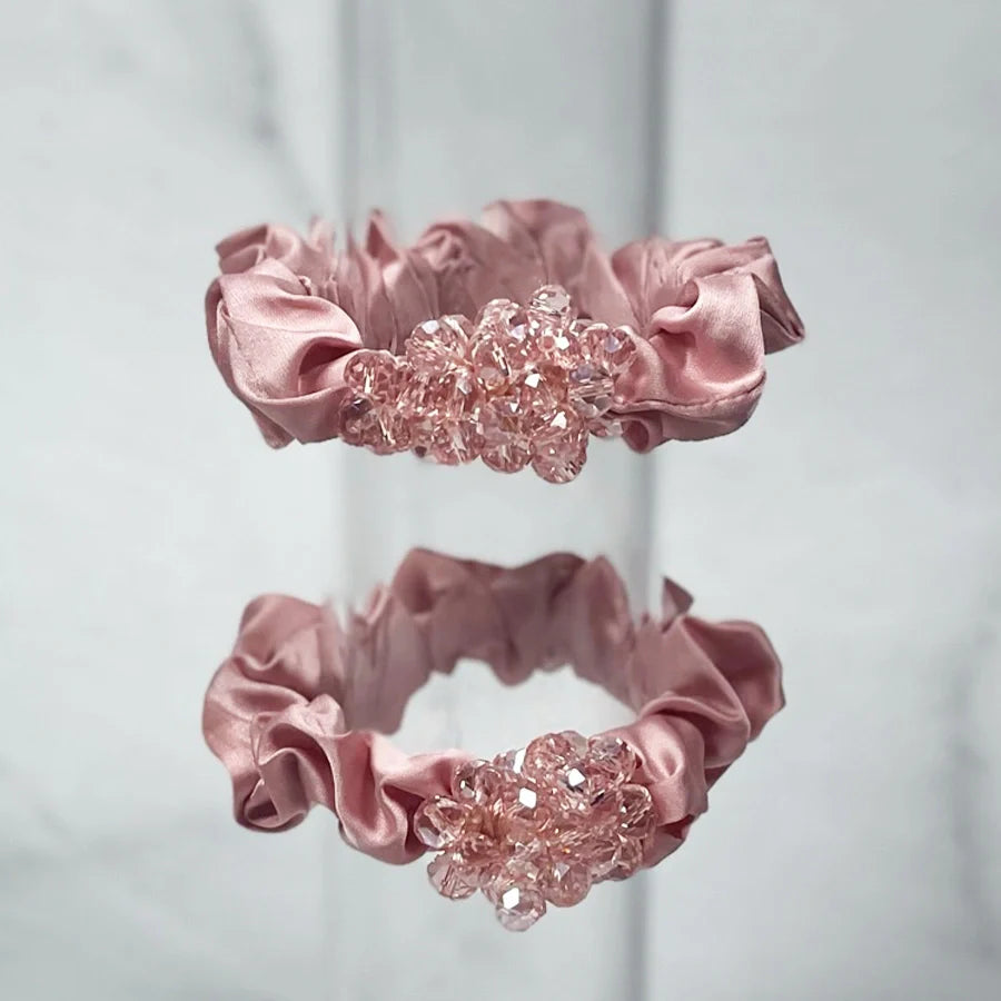 Pink satin crystal studded hair ties with clustered clear crystals for elegant hairstyles